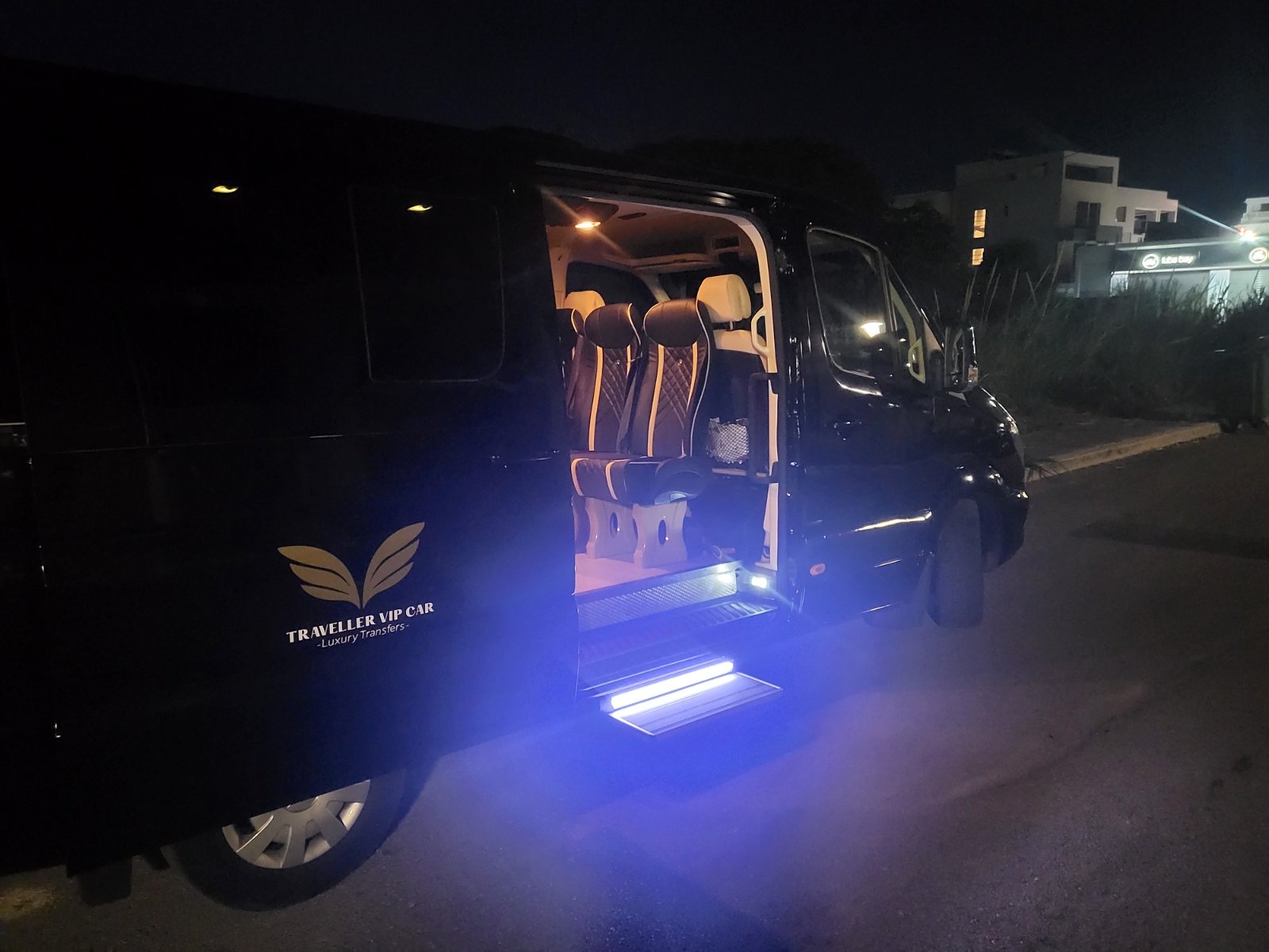 Black Mercedes-Benz Sprinter parked at night on Zakynthos